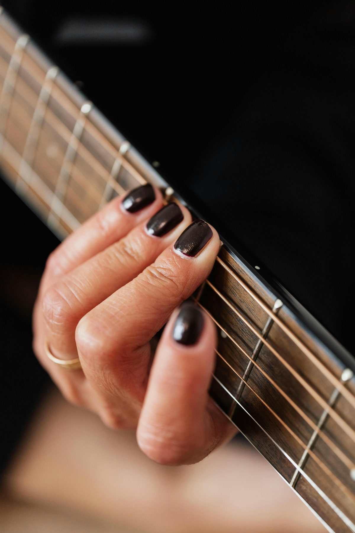 Close-up of a fretting hand on the fretboard